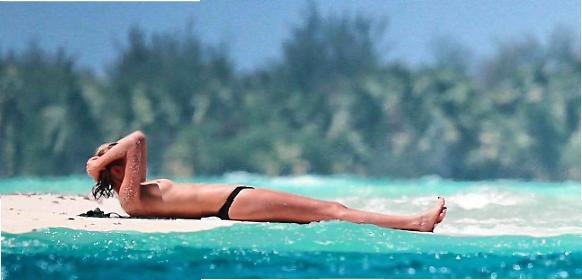 Toni Garrn baci e topless in vacanza a Bora Bora con Di Caprio 